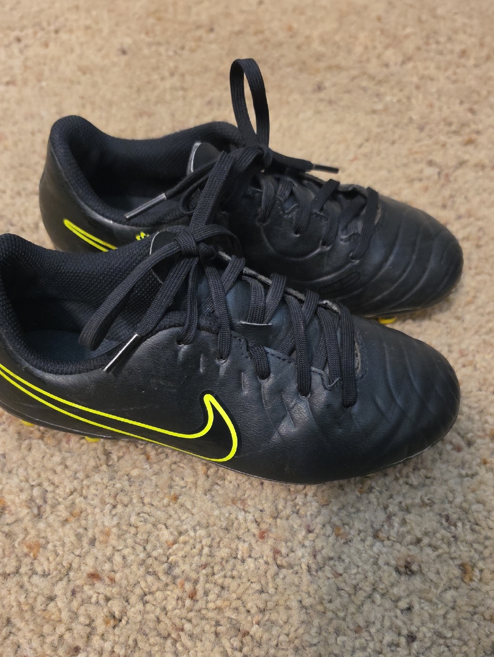 Nike Black Soccer Cleats with Neon Yellow Swoosh Accent